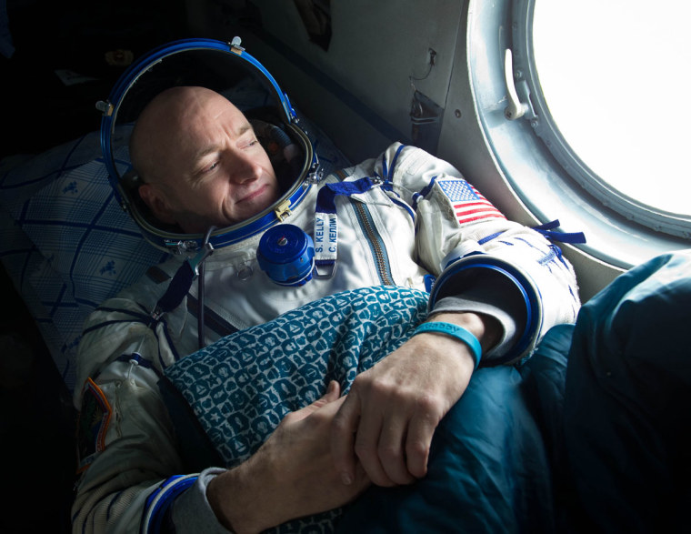 Expedition 26 Commander Scott Kelly looks out the window of a Russian Search and Rescue helicopter before the two hour helicopter ride to Kustanay, Kazakhstan shortly after he and fellow crew members Oleg Skripochka and Alexander Kaleri landed in their Soyuz TMA-01M capsule near the town of Arkalyk, Kazakhstan on Wednesday, March 16, 2011.  NASA Astronaut Kelly, Russian Cosmonauts Skripochka and Kaleri are returning from almost six months onboard the International Space Station where they served as members of the Expedition 25 and 26 crews. Photo Credit: (NASA/Bill Ingalls)