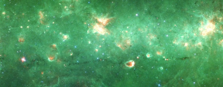 This image from NASA's Spitzer Space Telescope shows a newly identified "bone" of dust and gas in the Milky Way galaxy's skeleton. The structure, visible toward the bottom of the frame, is about 300 light-years long but just 1 or 2 light-years wide.