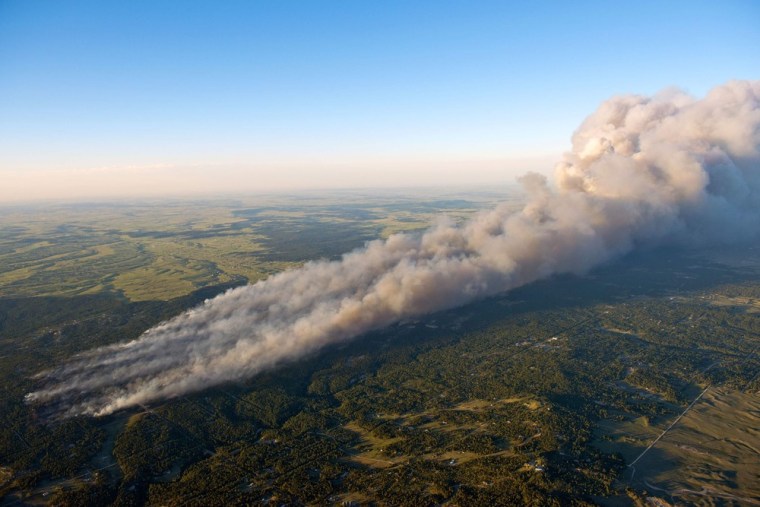 Image: An aerial photo shows wildfire burning homes in Black Forest community near Colorado Springs