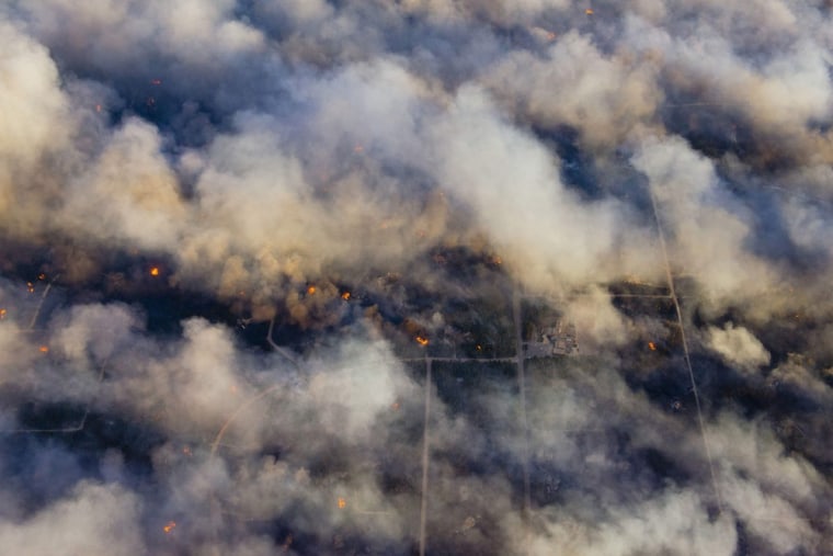 Image: An aerial photo shows wildfire burning homes in Black Forest community near Colorado Springs
