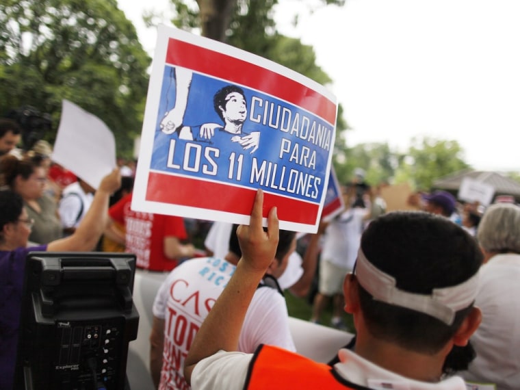 Image: A group of immigrants and activists for immigration reform gather to march to urge congress to act on immigration reform, on Capitol Hill in Washington