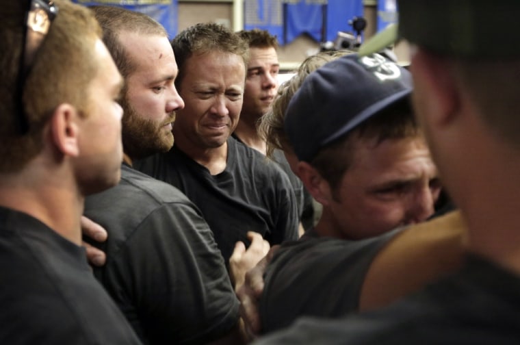 Image: Firefighters gather during a memorial service Monday, July 1, 2013, in Prescott, Ariz., honoring their 19 fellow firefighters killed battling a wildfire near Yarnell, Ariz.