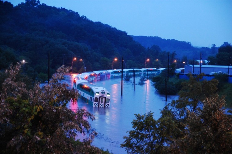 Image: A GO Train is stranded on flooded tracks in Toronto