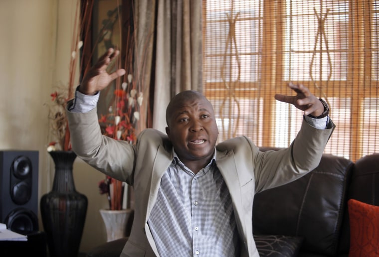 Image: Thamsanqa Jantjie gesticulates at his home during an interview on Thursday.