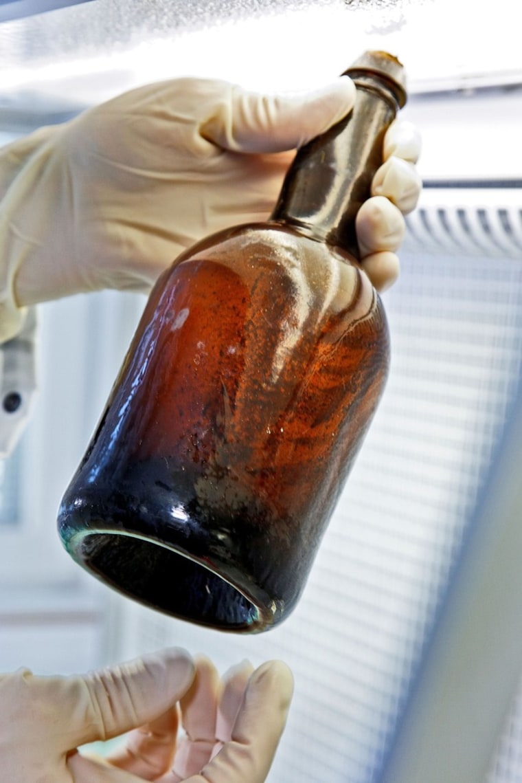 Image: A bottle of beer found in an 1840s shipwreck near Finland is seen in a handout photo