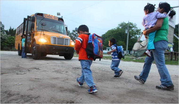 A bus gathers children from migrant farm families for preschool in North Carolina. The Migrant Head Start program aims to give parents an alternative to taking infants and toddlers into the fields.