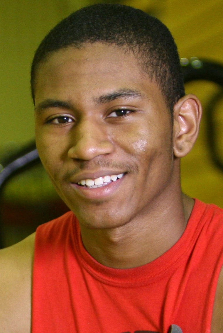 Elkhart Memorial High School senior and starting point guard Karvel Anderson poses on the home court of his team, the Crimson Chargers, in Elkhart, Indiana. While focusing on improving his academic standing at a prep school or junior college the first year after graduation, Karvel hopes to one day attend the University of Michigan. \"Just being accepted would erase everything I've ever done up 'til now,\" Anderson said of his dream school. \"I'm like Rudy... but for Michigan.\"