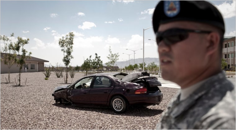 Image: Sgt. Mark Miranda and a wrecked car