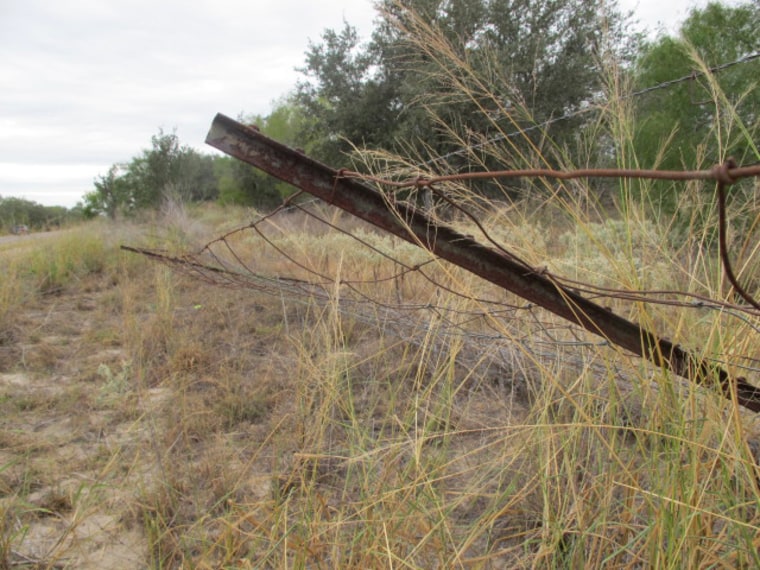 A fence on private land trampled by smugglers trying to get around a Border Patrol checkpoint in South Texas.