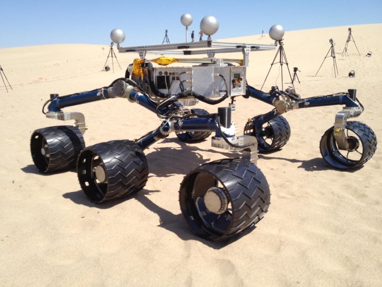 A mockup of NASA's Curiosity Mars rover gets its wheels dirty in sand dunes near California's Death Valley in early May 2012.