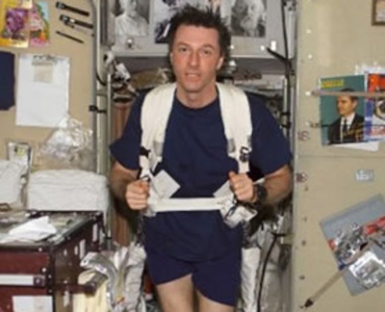 Astronaut Michael Foale exercises on the treadmill on the International Space Station. Daily exercise is recommended for astronauts to combat bone loss in space.