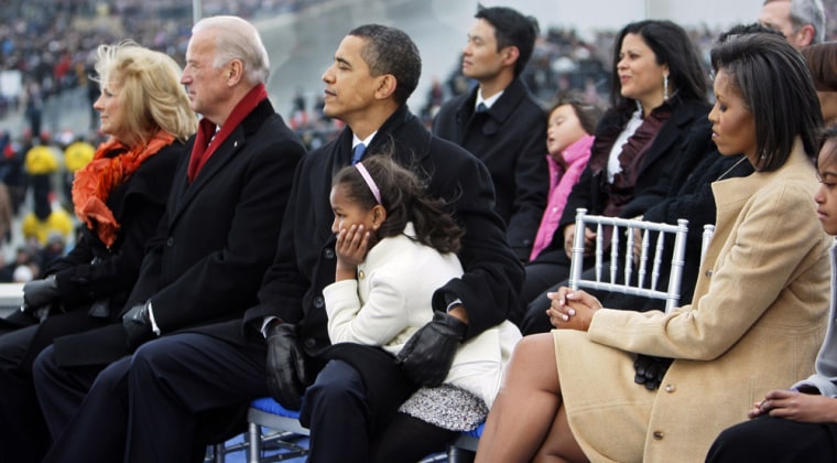 Image: Sasha Obama rests on her father's lap, at the Lincoln Memorial during an inaugural concert Sunday