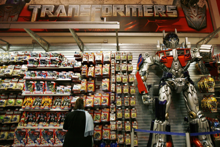 Image: A woman shops for Transformers toys made by Hasbro, in New York