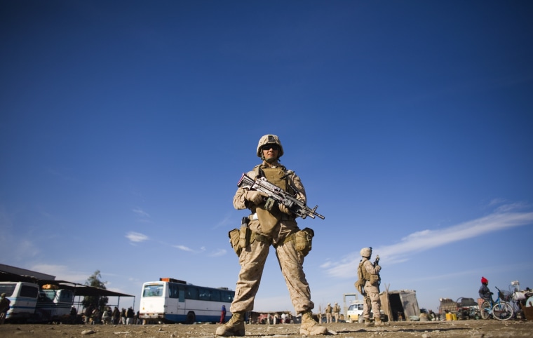 Image: U.S. Marines stand guard in the small town of Delaram