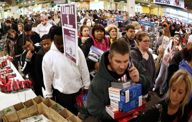 Image: Shoppers wait in line