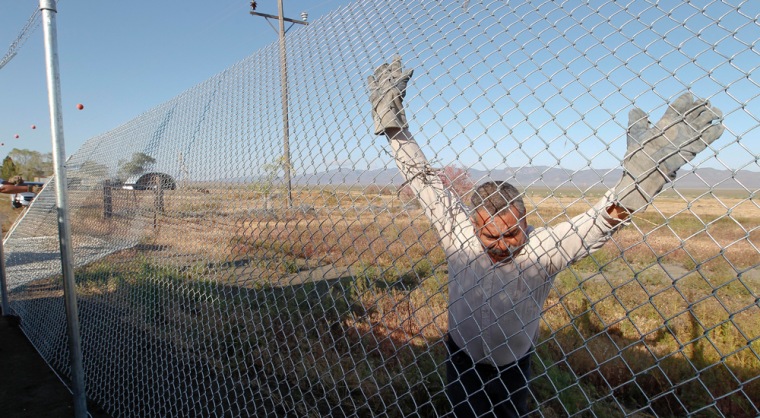 Abel Stenteno, along with other workers, has been working the past three months erecting a 3-mile fence around the company-owned town of Empire, Nev.