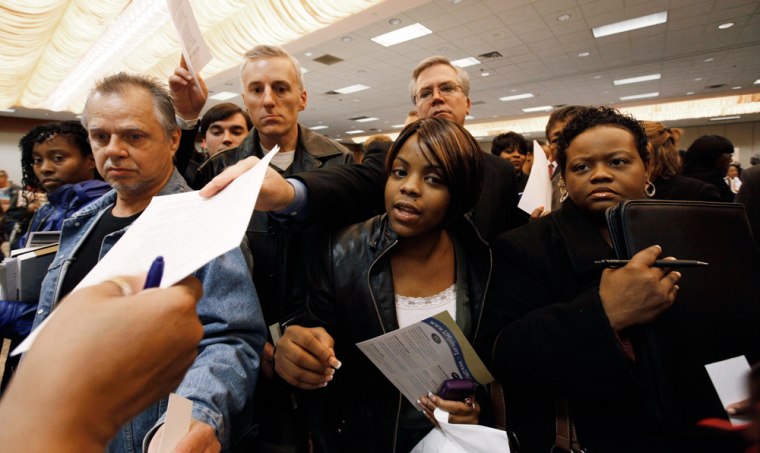 Image: Job seekers hand in resumes