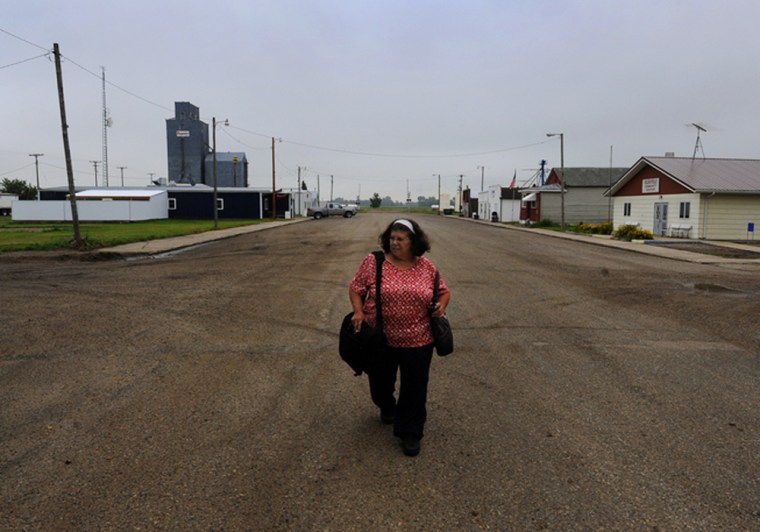 Janet Morgan walks through downtown Glenfield, North Dakota, her new home.
