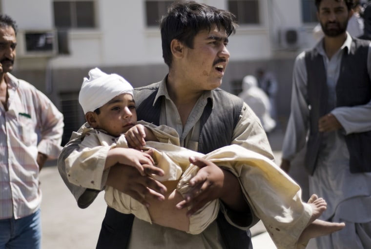 Image: Carrying a wounded child in Kabul