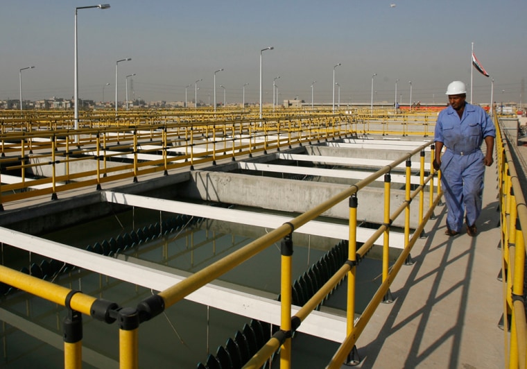 Image: Iraqi worker walks at new water treatment plant in Baghdad's Sadr City