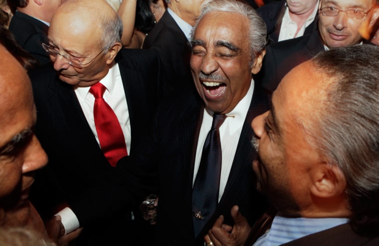 Image: Rep. Charlie Rangel laughs with supporters