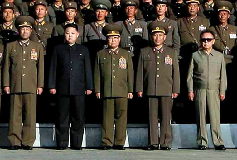 Image: North Korean leader Kim Jong Il with his son Kim Jong Un and soldiers.