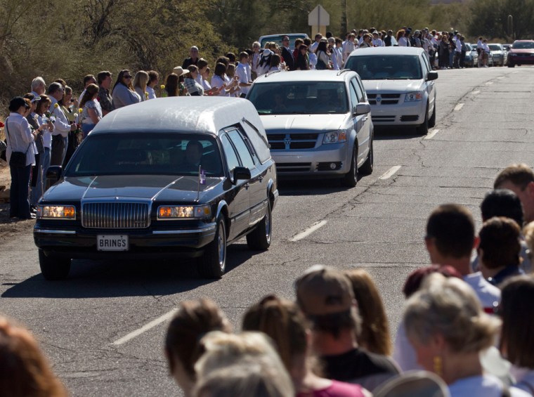 Image: Crowd watches hearse before funeral for Christina Taylor Green