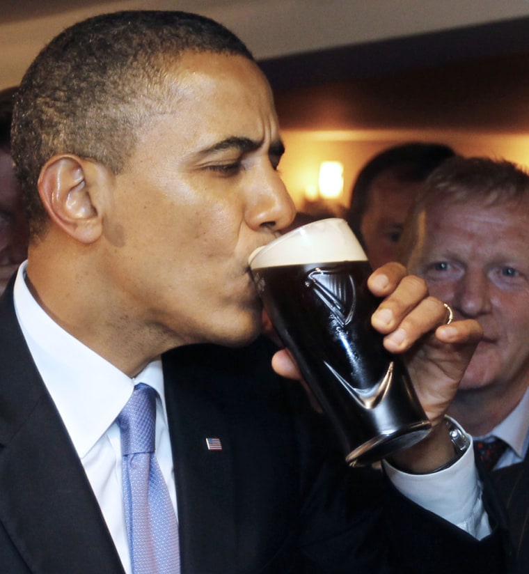 Image: Barack Obama drinks Guinness ber at Ollie Hayes pub in Moneygall, Ireland, the ancestral homeland of his great-great-great grandfather