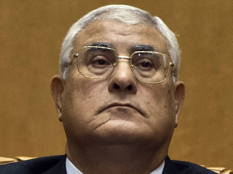 Image: Egypt's chief justice Adly Mansour pauses during his swearing-in ceremony as Egypt's interim president