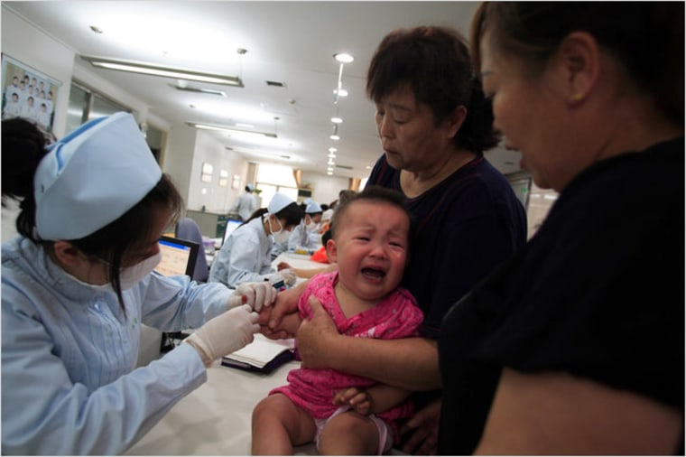 Image: Examining a baby at a hospital in China