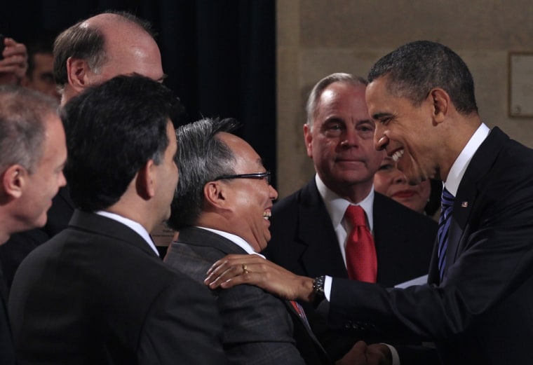 Image: U.S. President Barack Obama greets guests after addressing the U.S. Chamber of Commerce in Washington