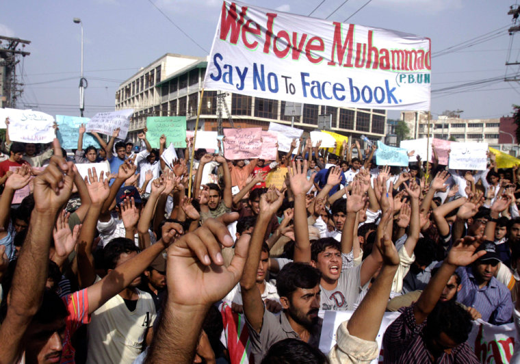 Image: Pakistani students chant slogans during a rally against Facebook page