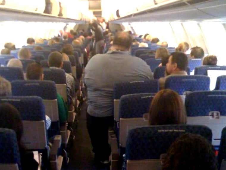 Image: Obese man on plane