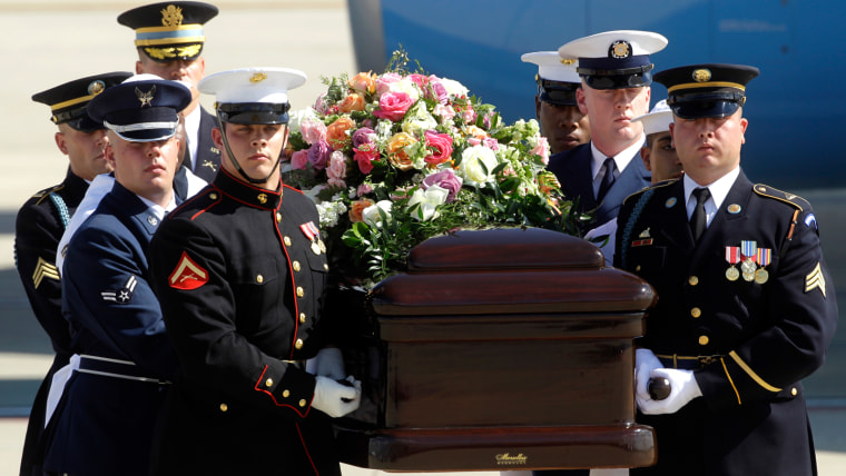 Image: A military honor guard carries the casket of former first lady Betty Ford on July 13