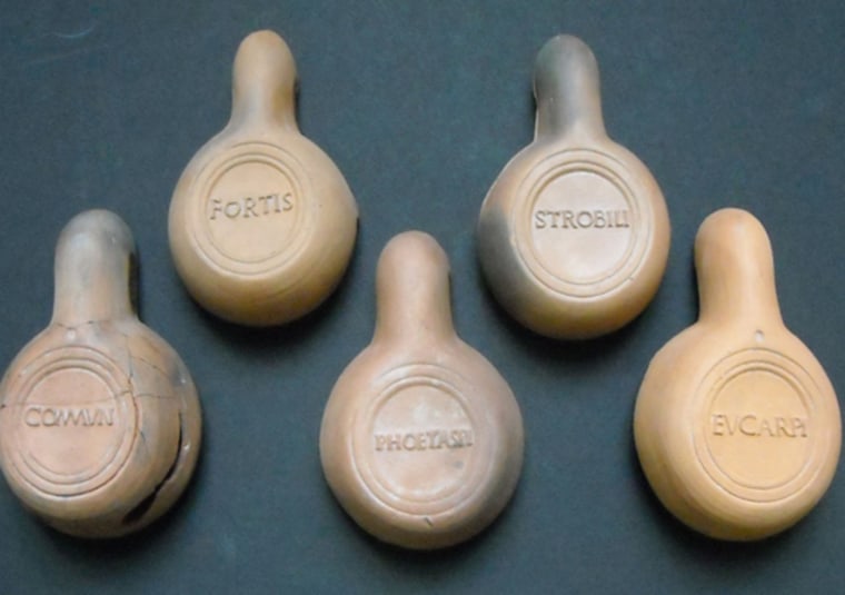 Soprintendenza per i Beni Archeologici dell'Emilia-Romagna |
 
The Big 'Brands' in Oil Lamps
Firmalampen, or \"factory lamps,\" found at sites in Modena, Italy. These lamps were one of the first mass-produced goods in RomanÂ times and they carried brand names clearly stamped on their clay bottoms.Â