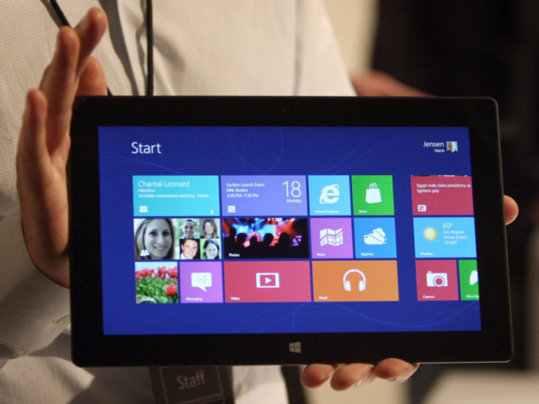 Image: A Microsoft representative holds a new Surface tablet computer as it is unveiled by Microsoft in Los Angeles