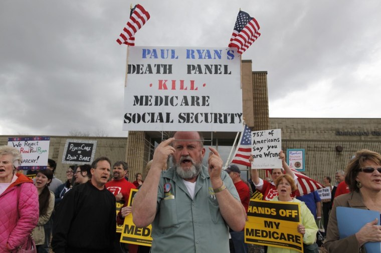 Image: Protesters are seen outside where U.S. Rep. Paul Ryan, R-Wis. speaks