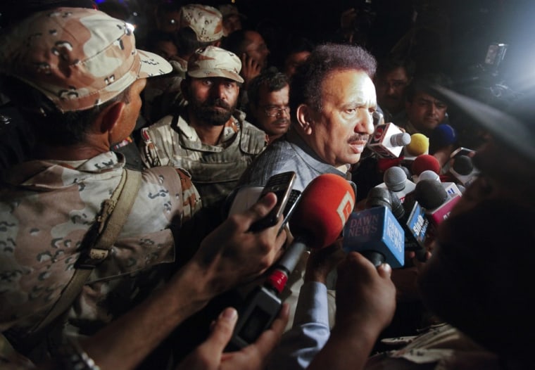 Image: Pakistan's Interior Minister Rehman Malik speaks to the media outside Mehran naval aviation base, which was attacked by militants, in Karachi