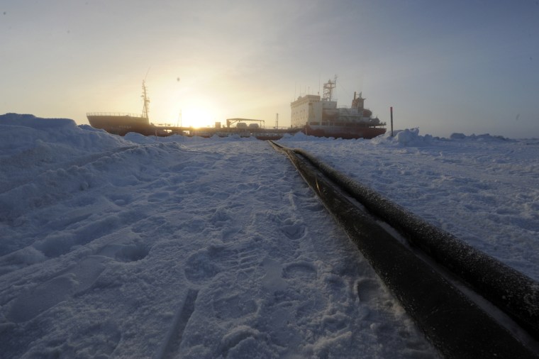 Image: Two hoses used to transfer fuel from the Russian Russian-flagged tanker Renda are seen in Nome
