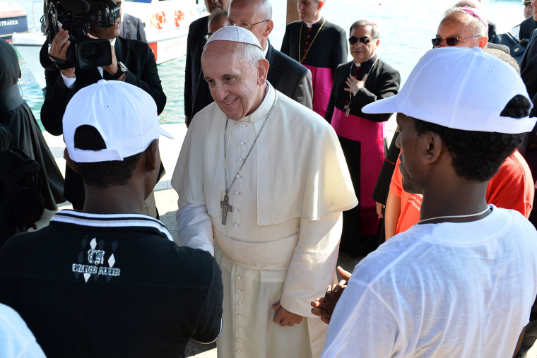 Image: Pope Francis meets a group of migrants on the Italian island of Lampedusa.