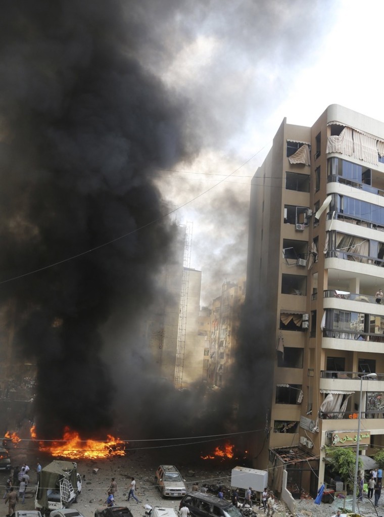 Image: Smoke rises from the site of an explosion in Beirut's southern suburbs