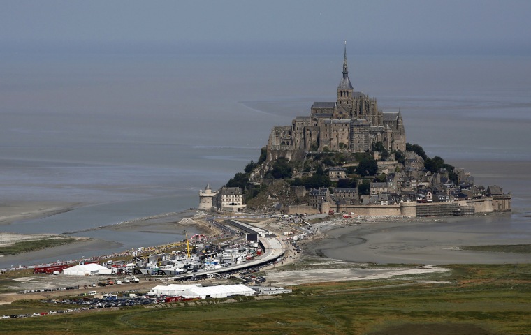 Image: Aerial view shows the Mont Saint-Michel during the 32 km individual time trial eleventh stage of the centenary Tour de France cycling race from Avranches to Mont-Saint-Michel