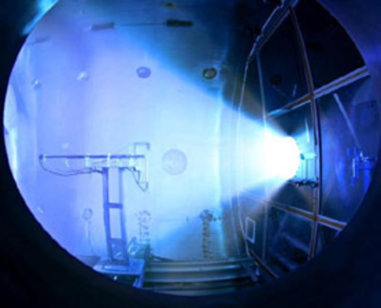 This photo, taken during a test of the new rocket, shows a VASMIR prototype operating at full power in a vacuum environment.