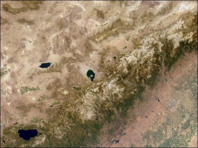 This multi-angle Imaging Spectroradiometer (MISR) image of the Sierra Nevada mountains is been oriented with north toward the left. Some prominent features are Mono Lake, in the center of the image; Walker Lake, to its left; and Lake Tahoe, near the lower left.