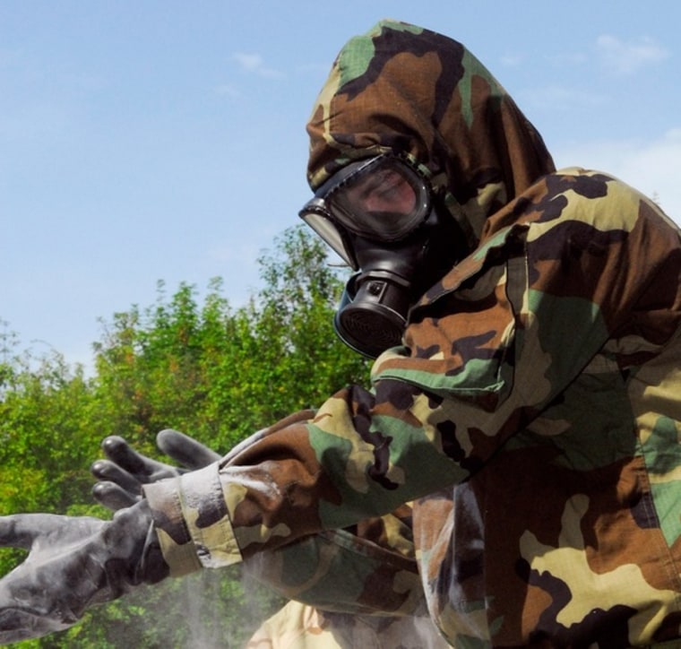 Sgt. Robert E. Blackwelder, Chemical, Biological, Radiological, Nuclear NCO, 4/2 Stryker Cavalry Regiment, decontaminates his equipment during a Chemical, Biological, Radiological, Nuclear  Course.