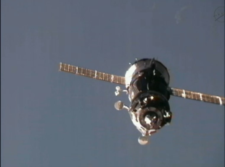 The Russian Soyuz TMA-03M pulls up to the International Space Station on Thursday, carrying three new crew members for the station's Expedition 30 mission. 
