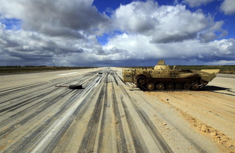 Image: An army armoured vehicle is seen at a military airport runway in Al Abrak