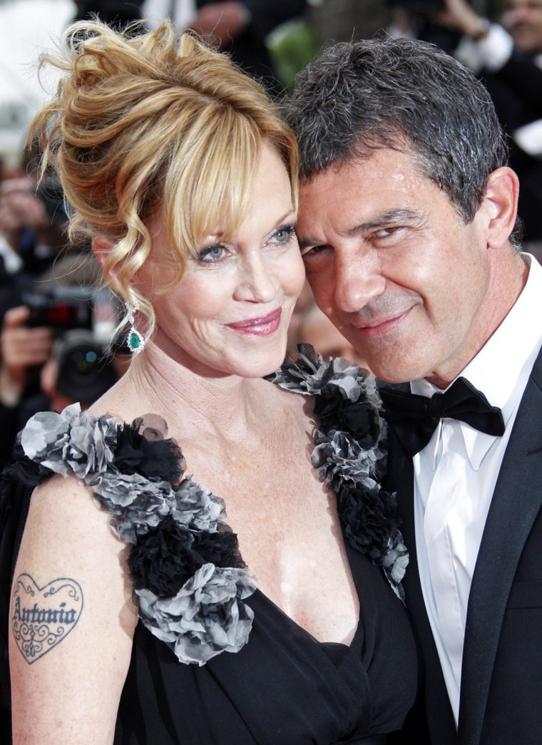 Image: Spanish actor and director Banderas and his wife actress Griffith arrive on the red carpet for the opening ceremony of the 64th Cannes Film Festival in Cannes