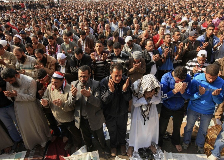 Image: Egyptian protesters pray during a march in Tahrir Square in Cairo