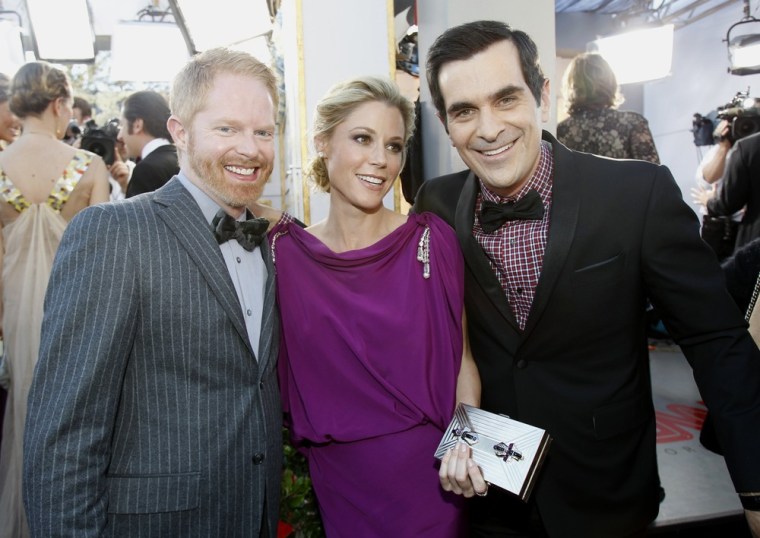 Image: Actors Jesse Tyler Ferguson, Julie Bowen and Ty Burrell arrive at the 18th annual Screen Actors Guild Awards in Los Angeles